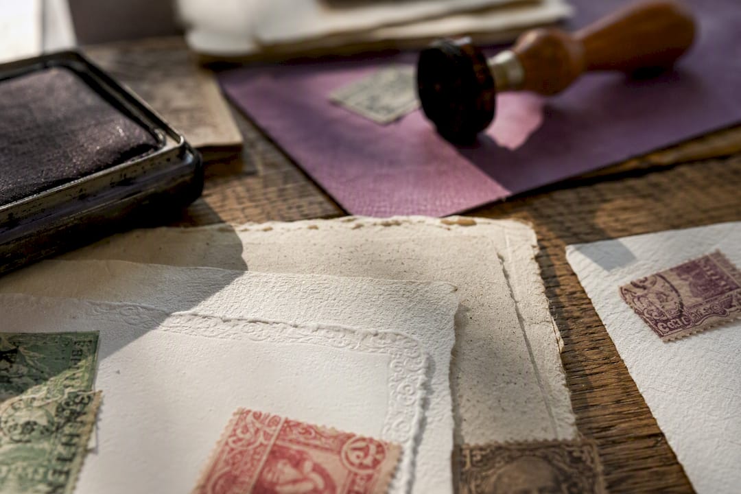 Close-up of postage and legal stamp papers with stamps