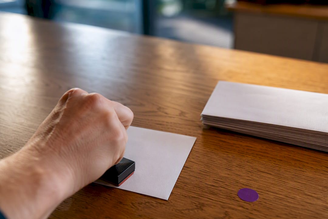 Testing a business stamp on an envelope