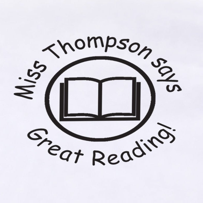 Close-up of a black personalised Book teacher stamp sample impression with open book design