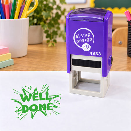 Purple SD4U 4933 Well Done stock teacher stamp on a classroom desk with a green impression