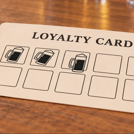 Close-up of black beer impressions on an example loyalty card