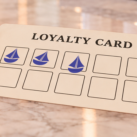 Close-up of blue boat impressions on an example loyalty card