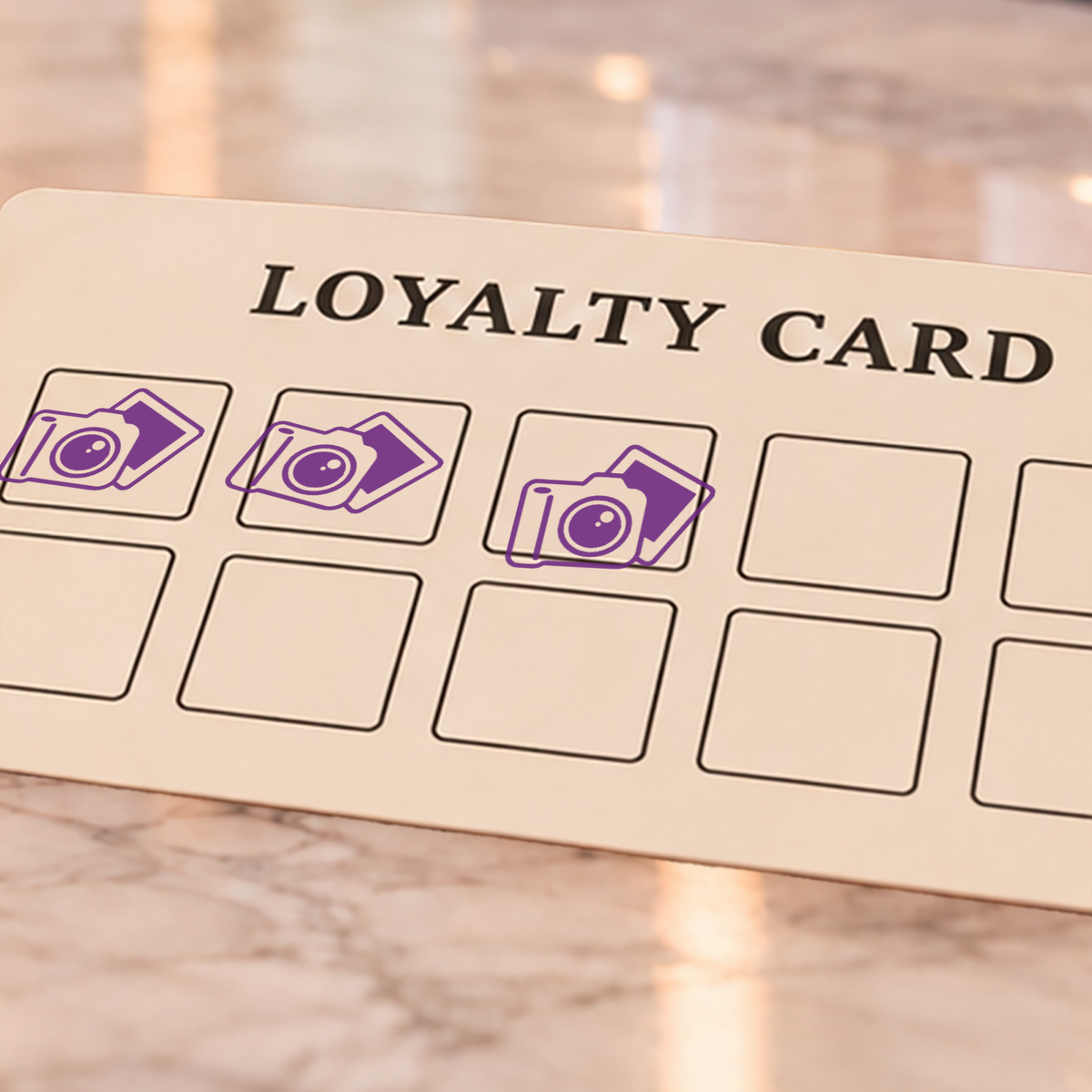 Close-up of violet camera impressions on an example loyalty card