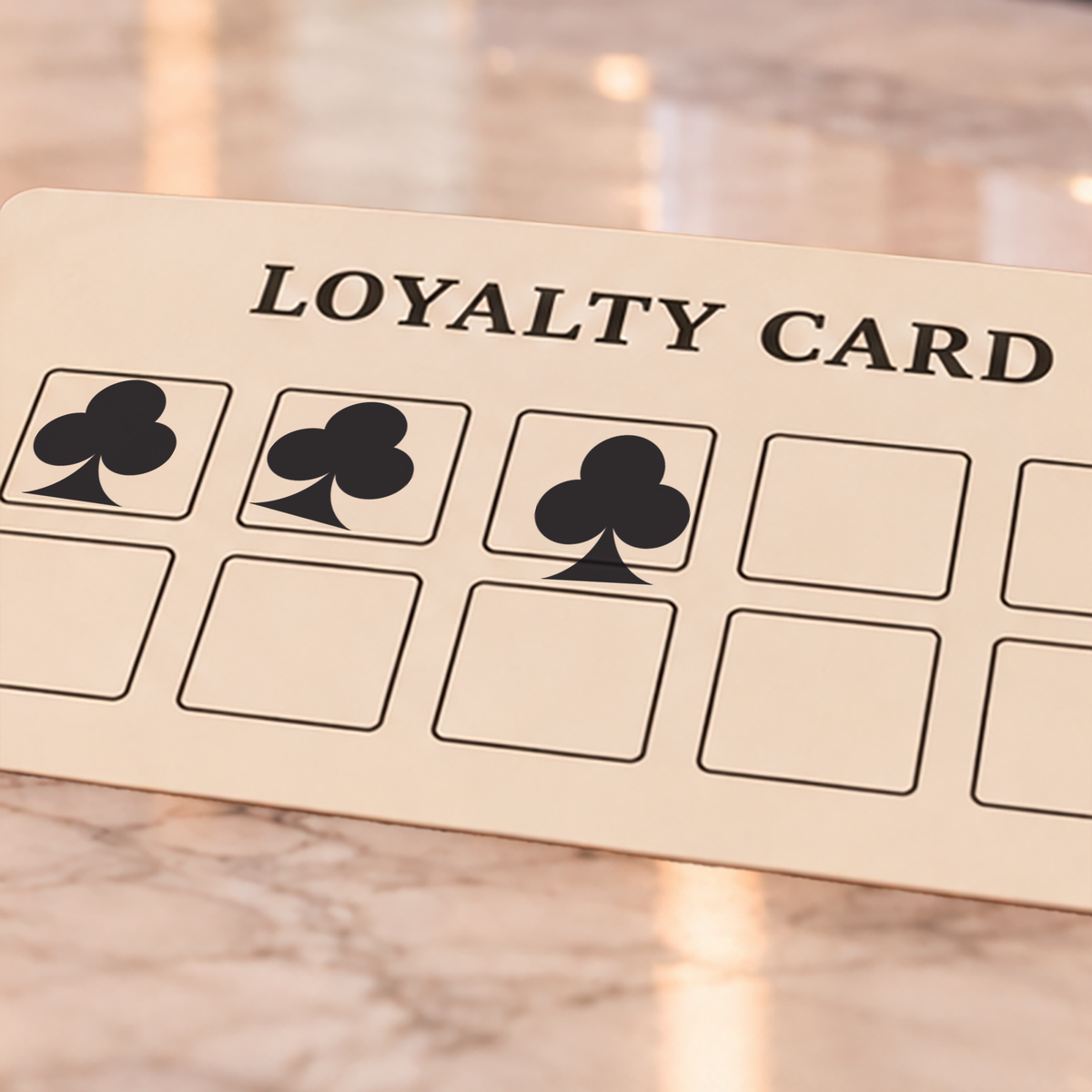 Close-up of black club impressions on an example loyalty card