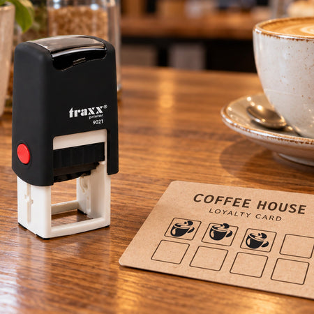 Traxx 9021 coffee cup loyalty stamp with black impressions on an example card