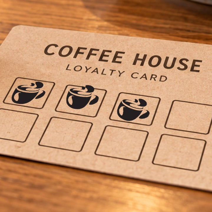 Close-up of black coffee cup impressions on an example loyalty card