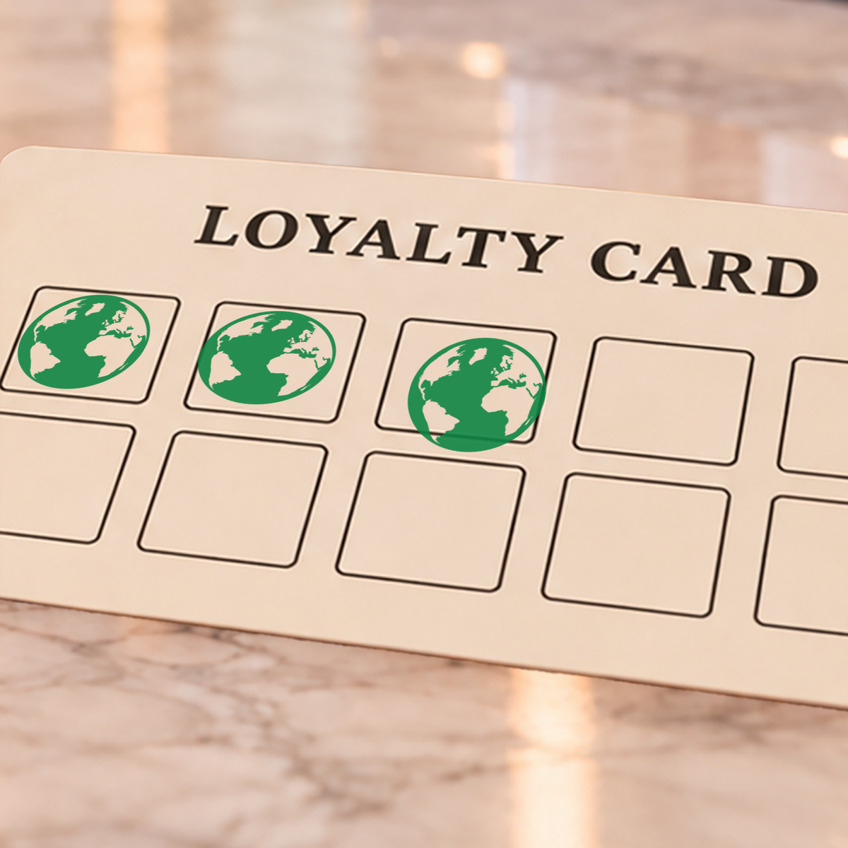 Close-up of green earth impressions on an example loyalty card