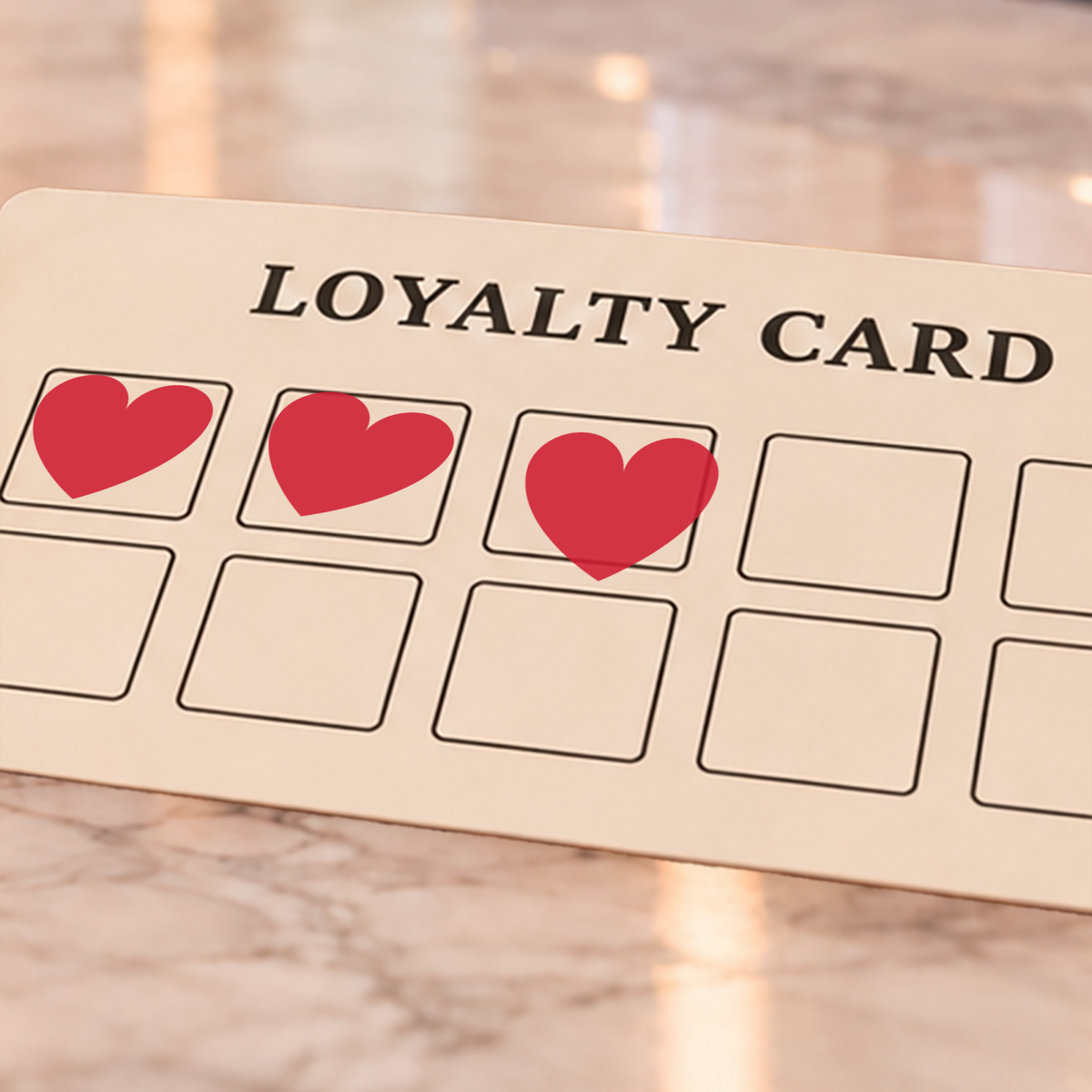 Close-up of red heart impressions on an example loyalty card
