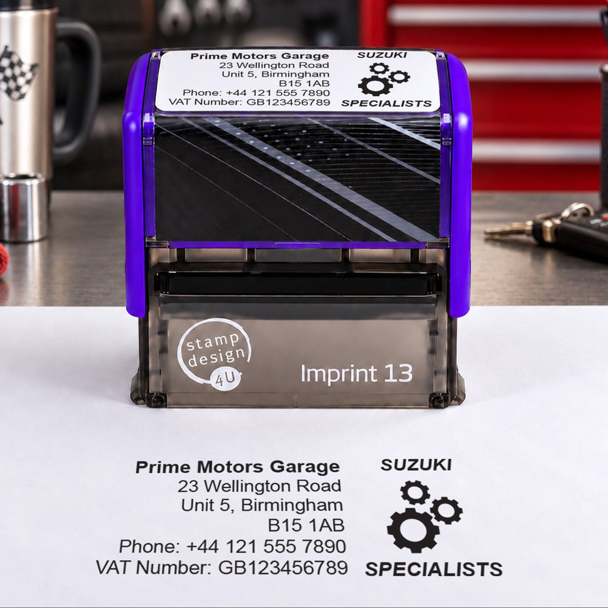 SD4U Imprint 13 Suzuki Specialists personalised garage stamp on a workshop bench with a black example impression