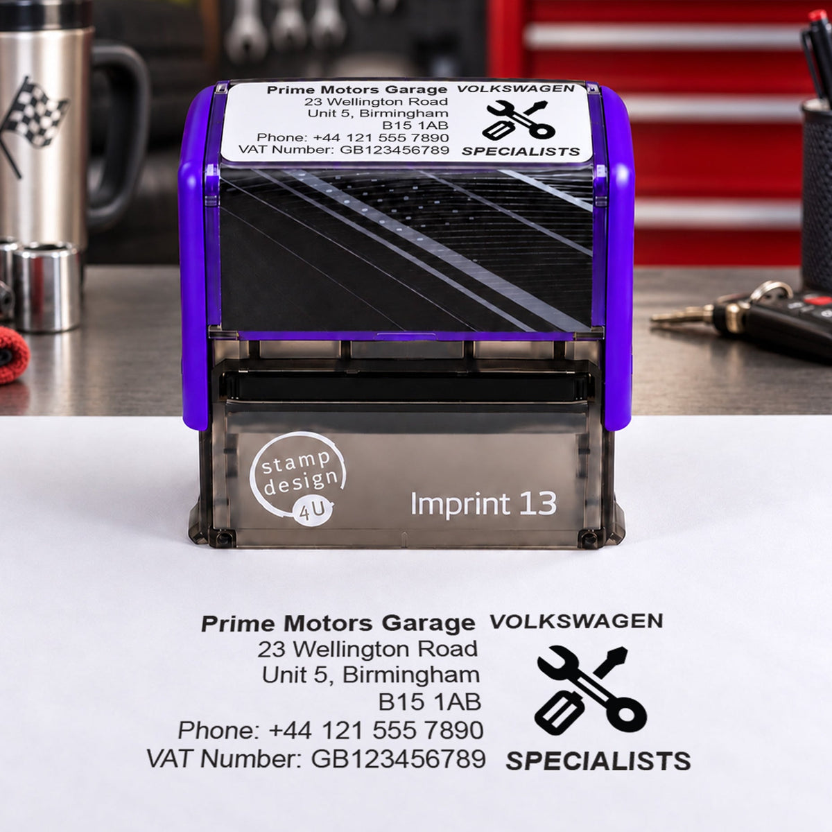 SD4U Imprint 13 Volkswagen Specialists personalised garage stamp on a workshop bench with a black example impression