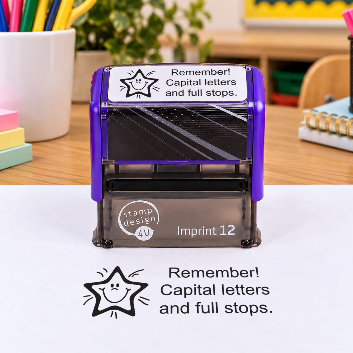 Remember Capital Letters and Full Stops teacher stamp: pictured purple Imprint 12 casing with black smiling-star reminder impression