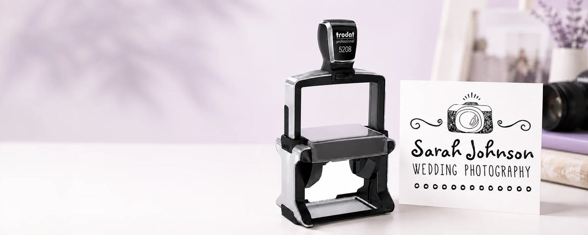 Trodat Professional 5208 large logo stamp beside its matching photography logo impression